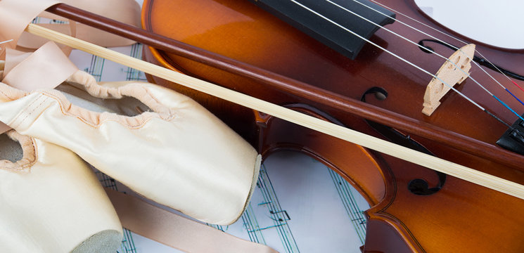 violin and ballet shoes on the background music