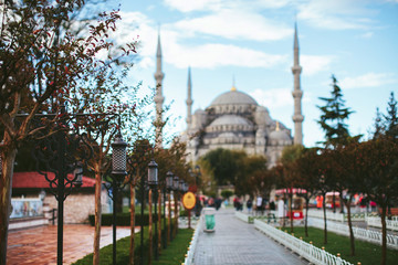 Naklejka premium Turkish lantern weighs against the backdrop of the mosque