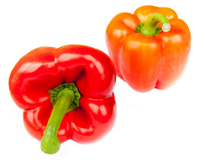 Two red peppers, isolated on white background