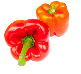 Two red peppers, isolated on white background