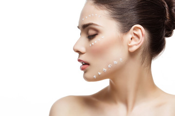 Naklejka premium Girl with cream dots on face