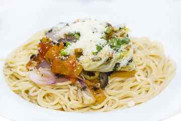 Spaghetti with vegetables and basil olives and cheese