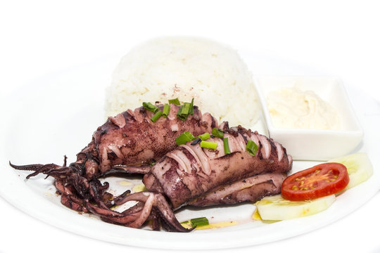 with rice and salad and sauce grilled squid