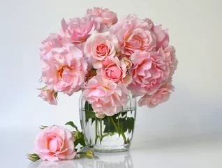 Bouquet of pink roses in a vase. Romantic floral still life with pink roses. © ivoraobrazy