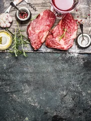 Photo sur Plexiglas Viande Two raw fillet steaks for grill,BBQ or frying with herbs and spices on rustic background, top view, place for text. Meat food. Argentinian steak