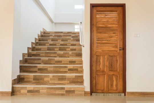 staircase and wood door in residential house