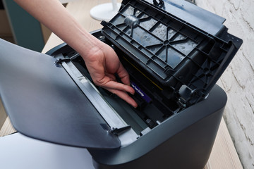 extract cartridge of  laser printer to replace
