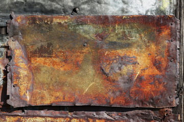 Old rusty metal plate texture background, with lichen, moss and patina, from 1850 year