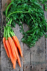 organic carrots on a wooden background