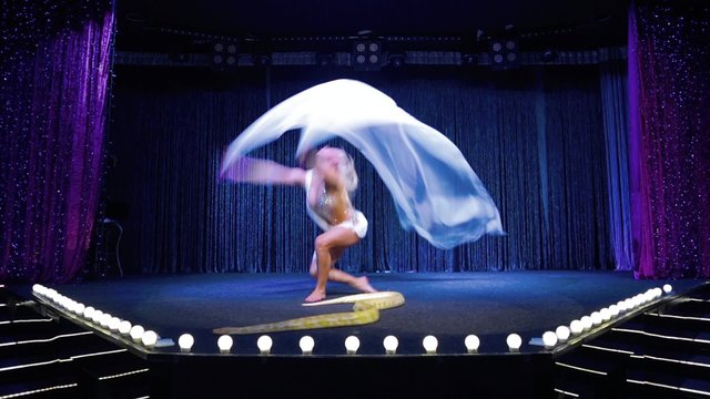 Beautiful blonde girl and python