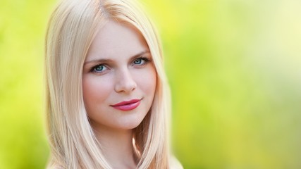 Naklejka premium Vera, blonde face in nature