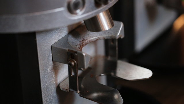   making coffee by machine at cafe