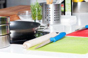 Restaurant food preparation, knives cutting boards.