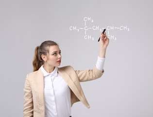 Woman chemist shows a molecular structure