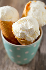 vanilla ice cream on wooden surface