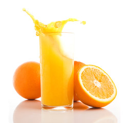 Fresh orange fruit and splash in glass