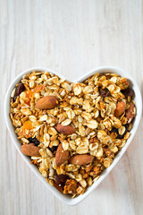 granola in a heart-shaped bowl