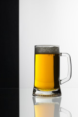 Glass of beer on the black and white background