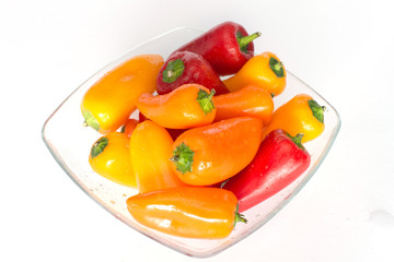 colorful smal peppers on a glas