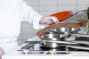 Restaurant food preparation, knives cutting boards.