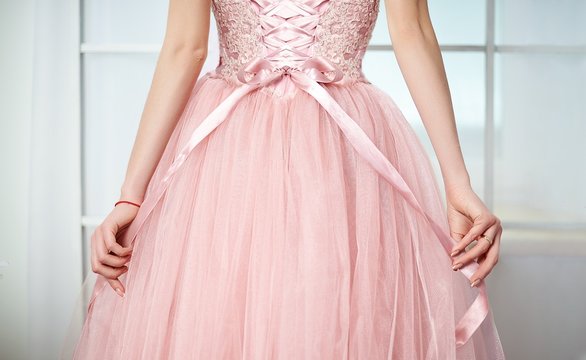 Fototapeta Bride in a pink dress with flowers
