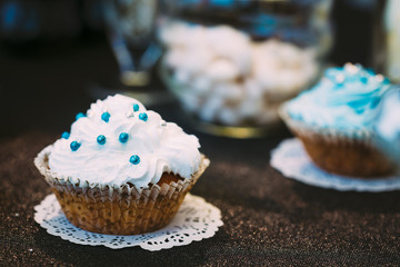 Dessert Sweet Tasty cupcake in Candy Bar On Table