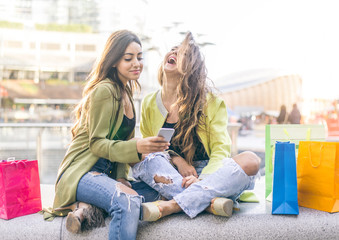 Girlfriends looking at smartphone