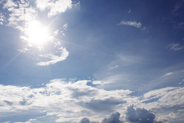 White Clouds on the blue sky with sun shines