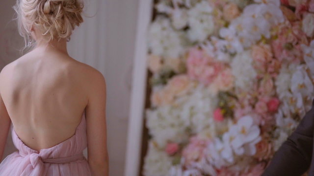 Wedding in style pale pink. Newlyweds pert smile and rejoice in his happiness.