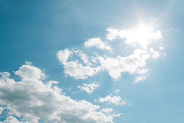 Sun shines through white clouds for pattern