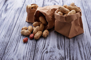 Peanuts in shell on wooden background