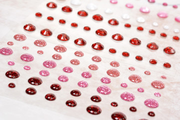 Rhinestones scattered on soft pink vintage background