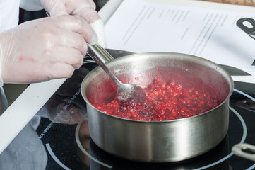 Pans in the kitchen, the cook hands.