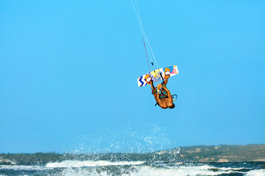 Extreme Water Sport. Kiteboarding, Kitesurfing Action. Professional Kiter Makes Difficult Trick In Air. Active Lifestyle. Hobby. Recreational Sporting Activity. Sports. Summer Fun, Adventure.