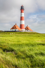 Fototapeta na wymiar Traditional lighthouse at North Sea