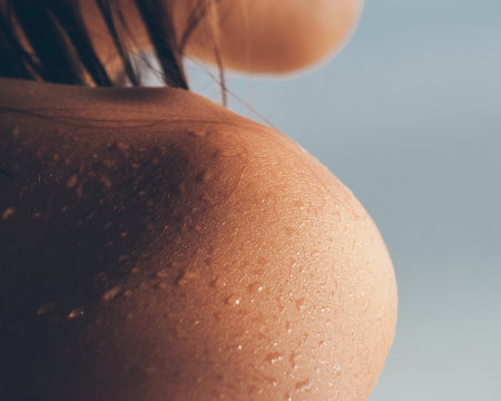 Wet shoulder of a young woman