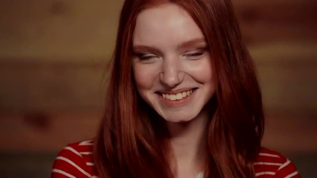 Beautiful redhead girl showing different emotions.