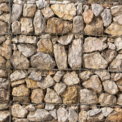 Stone construction with steel mesh which was dam embankment eros