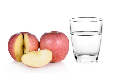 Glass of water and apple isolated on white background