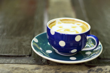 Coffee cup on wooden tables - vintage effect style pictures