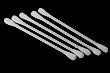soft cotton swabs  on black background