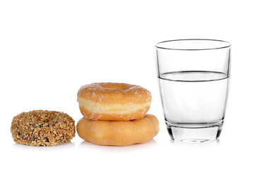 donut and glass of water isolated on over white background