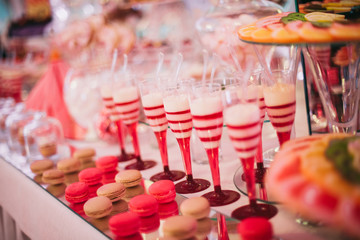 Different delicious desserts and cakes on the buffet table
