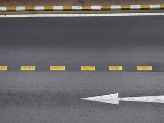 Arrow on the road by top view