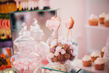 Different delicious desserts and cakes on the buffet table