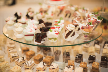 Different delicious desserts and cakes on the buffet table