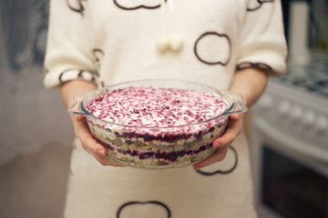 Salad Herring under a fur coat in a glass dish.