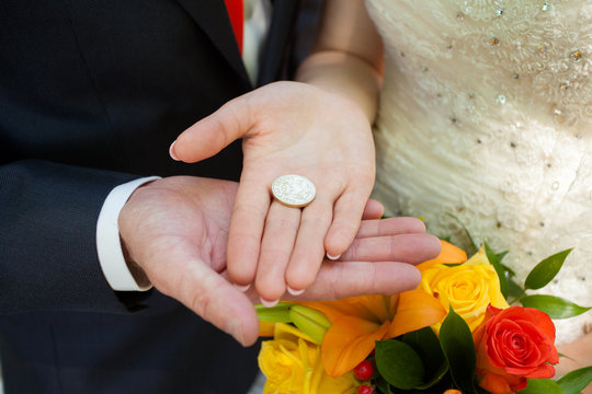 Coin For Luck In Hands The Newlywed