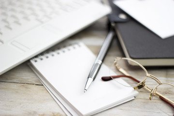 Office workplace with laptop and agenda on wood table