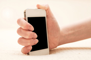 Woman using her smartphone inside